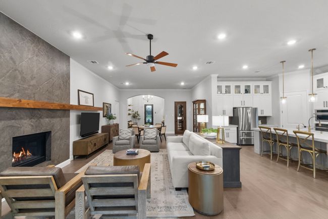 Living area and chef's kitchen highlighting the open main area | Image 12
