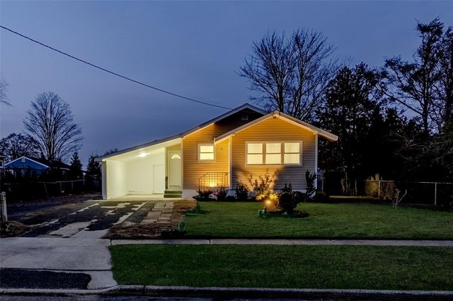 View of front of house featuring a carport and a yard | Image 38