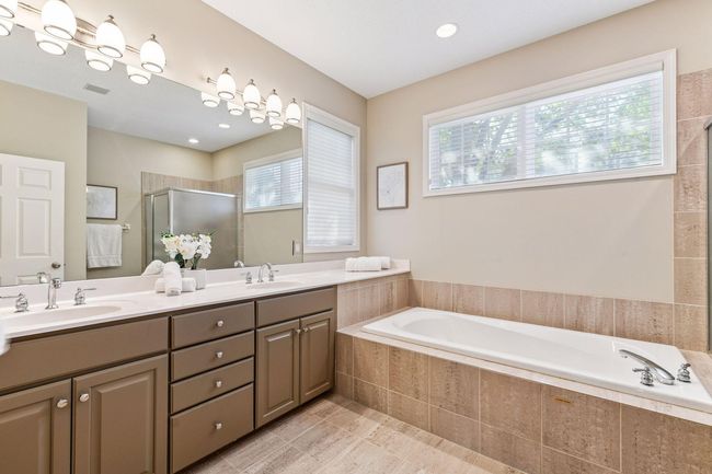 Spa-like primary bath vibes—comfort meets calm. | Image 18