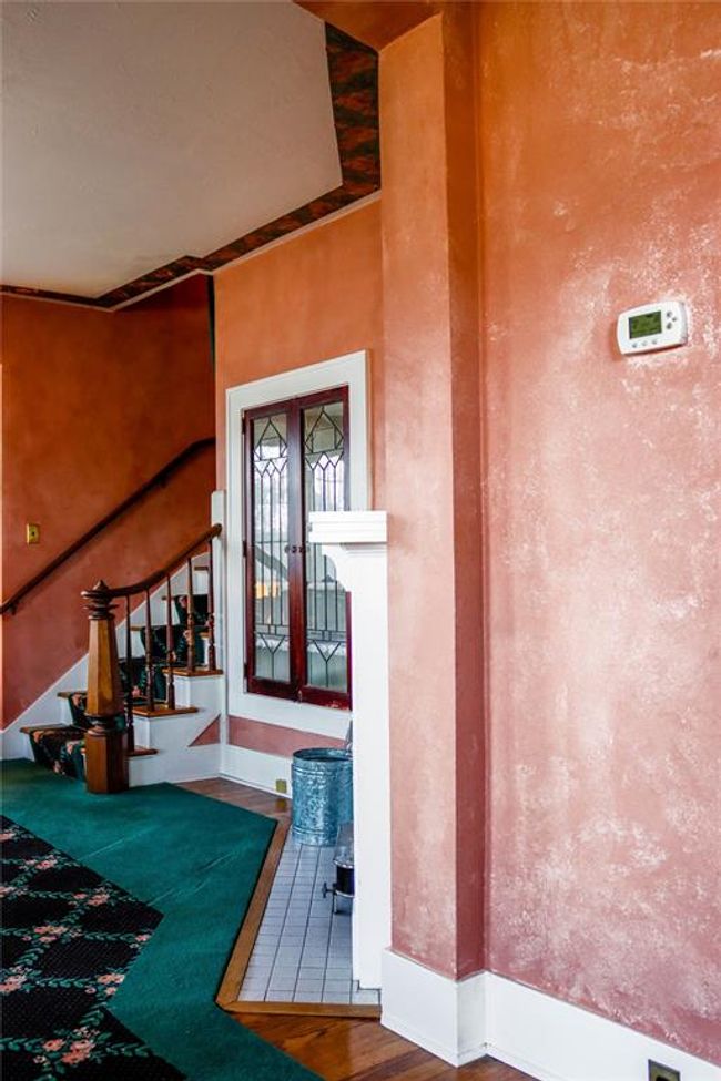 The grand staircase, near the fireplace | Image 15