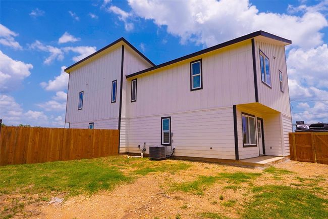 Rear view of property with a fenced backyard | Image 4
