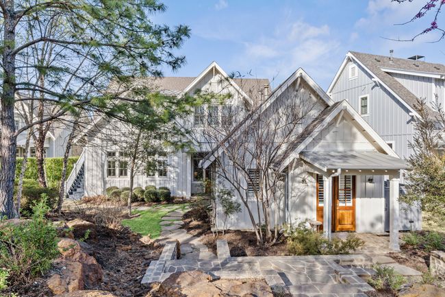 View of front facade featuring board and batten siding, a shingled roof, and stairs | Image 35