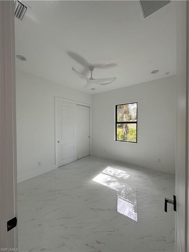 Unfurnished bedroom featuring ceiling fan | Image 27