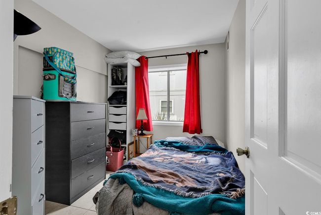 Bedroom featuring light tile patterned floors | Image 17