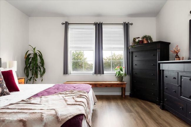 Bedroom with wood finished floors | Image 13
