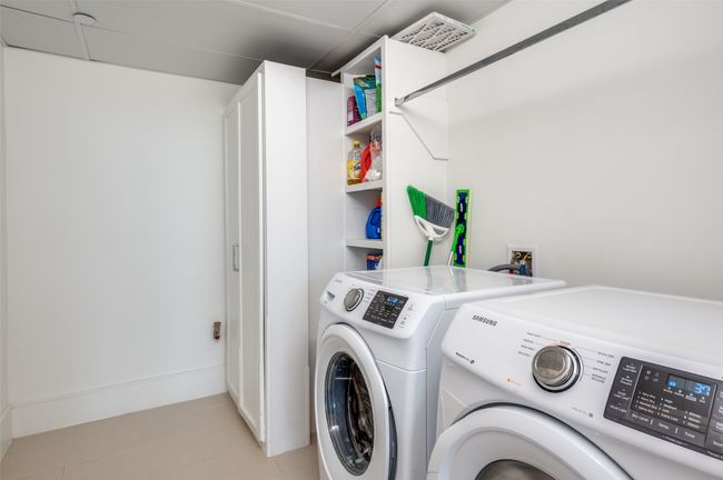 Laundry room with builtin cabinets and shelves | Image 31
