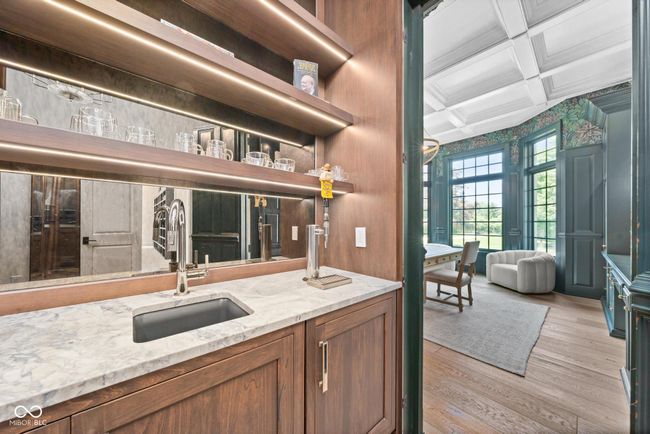 primary room, wet bar featuring a sink | Image 31