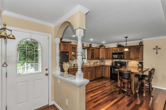 Private Entrance into an Inviting Open Living Space on the townhouse side | Image 22