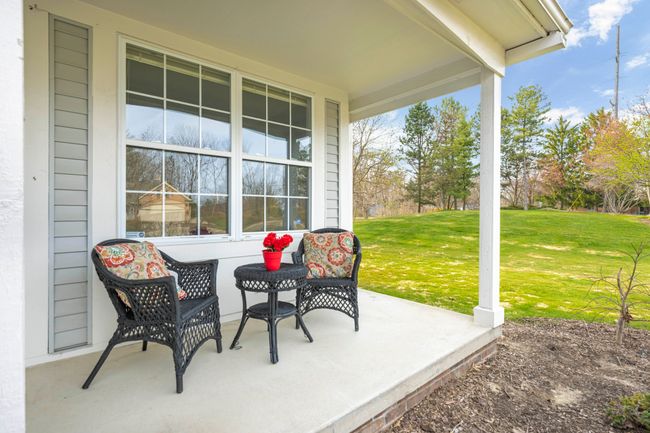 Peaceful covered front porch. Pretty setting. | Image 5
