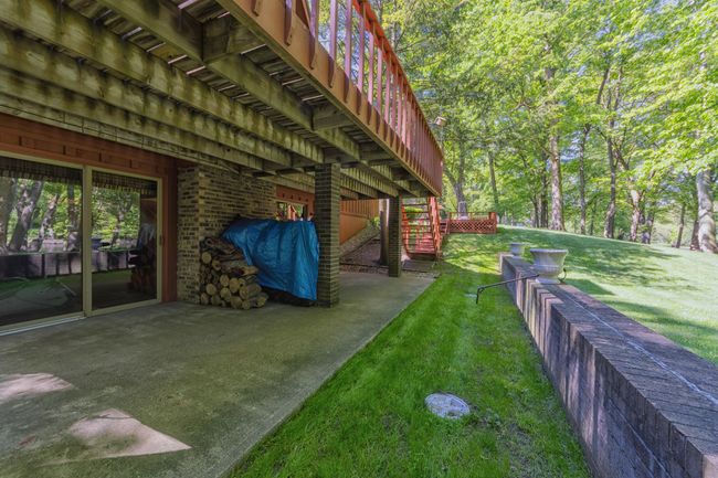 Walk out basement patio, St. Joe River side of home. | Image 29