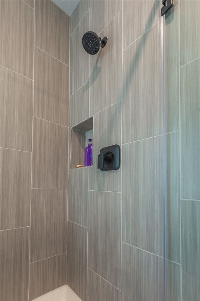 Full bathroom featuring tiled shower | Image 18