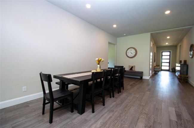 Dining area with plenty of room for a large table. | Image 13