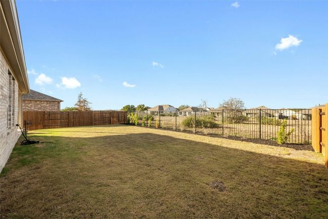 Great distance between the other homes and even a walking trail behind the home. | Image 37