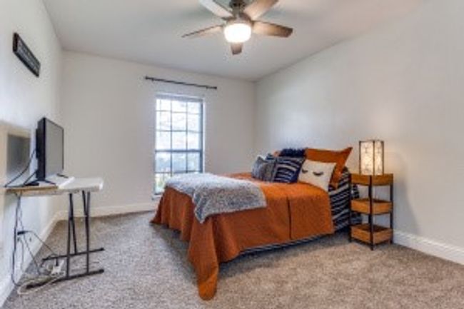Bedroom with carpet floors and baseboards | Image 16