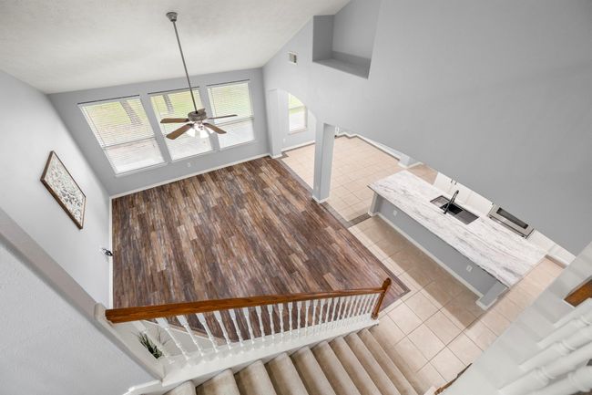 From above, you can see how the living, kitchen, and breakfast spaces come together—framed by natural light and thoughtful design. | Image 25