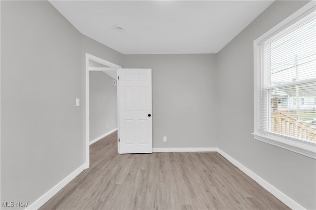Spare room with light wood-style flooring and baseboards | Image 14