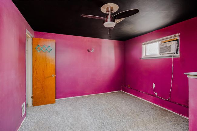 Unfurnished room with carpet, visible vents, and a ceiling fan | Image 22