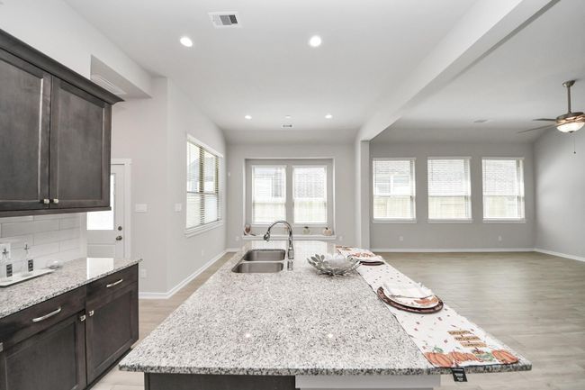 Open sightlines from the kitchen to the family room – ideal for gatherings | Image 21
