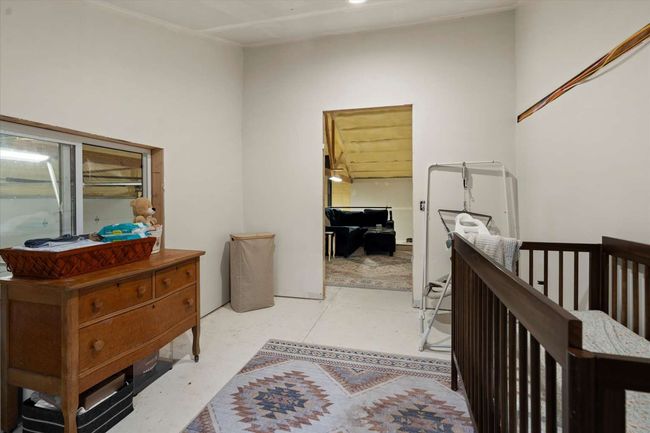 Hallway with light flooring and an upstairs landing | Image 29