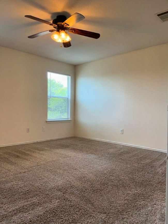 Primary bedroom with carpet and ceiling fan | Image 18