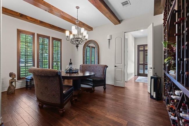 There is a formal wining & dining room with beamed ceilings. The quality of construction and finishes is superb throughout the home! | Image 14