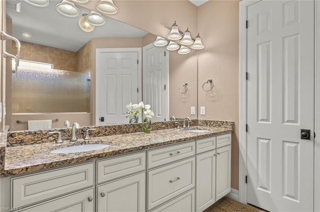 Bathroom with vanity and a shower | Image 19