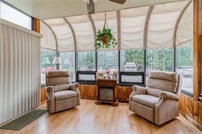 Solarium with sliding glass doors to outside | Image 12