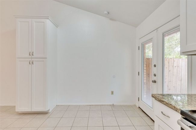 Unfurnished dining area with lofted ceiling and light tile patterned flooring | Image 23