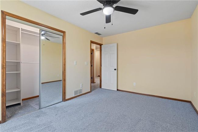 Unfurnished bedroom with baseboards, visible vents, and carpet floors | Image 9