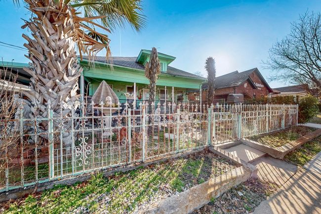 Rear view of property with covered porch and fence | Image 9