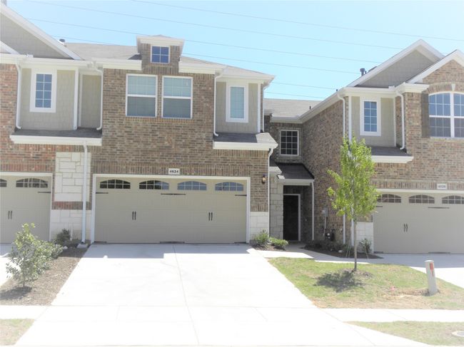 View of property with a garage and driveway | Image 16