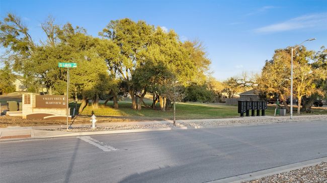 View of road with curbs, street lighting, and sidewalks | Image 32