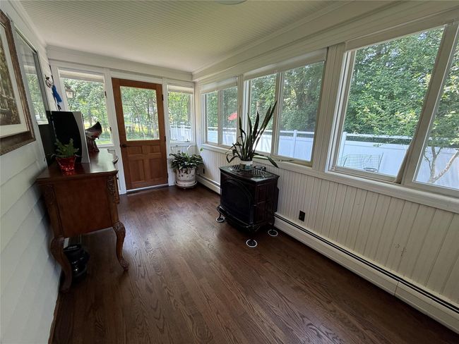 Enjoy morning coffee or evening reading in this charming well lit area | Image 9