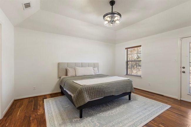 Primary suite with door to backyard. | Image 20