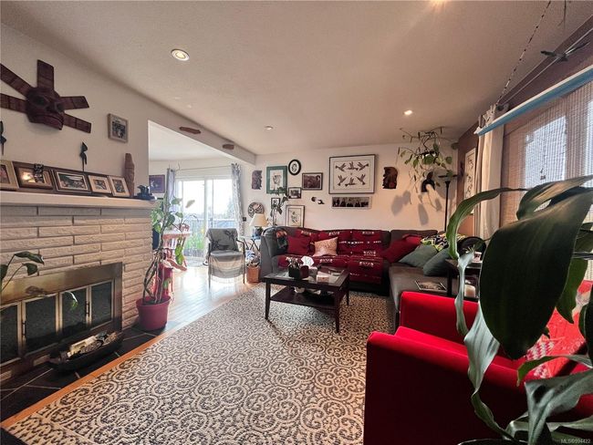 Living area with recessed lighting and a fireplace | Image 10