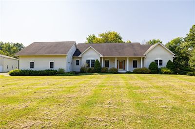 Welcome to 371 Gilmore Road, Brockport, NY 14420. Located in the town of Clarkson this charming 2 bedroom home with an additional office (or 3rd bedroom) was built in 2004 has an attached 2.5 car garage. | Image 1