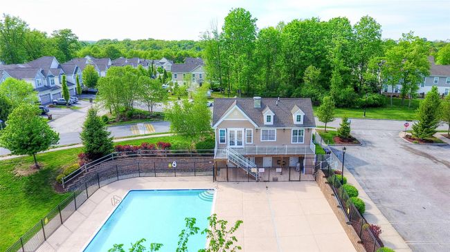 View of pool featuring stairs, fence, and a residential view | Image 35