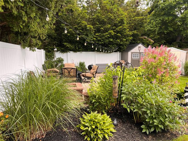 View of patio with a wooden deck | Image 7