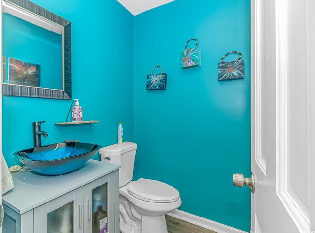 Half bathroom with vanity and wood finished floors | Image 9