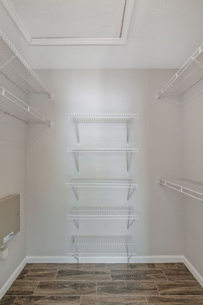 Primary bedroom closet has pull-down attic for extra storage! | Image 20
