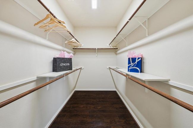 A nice sized closet offers plenty of space for his and her clothing. | Image 34