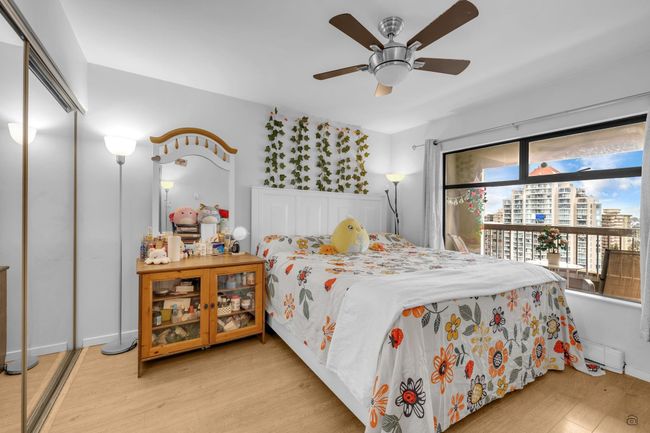 Bedroom with wood finished floors and a ceiling fan | Image 21