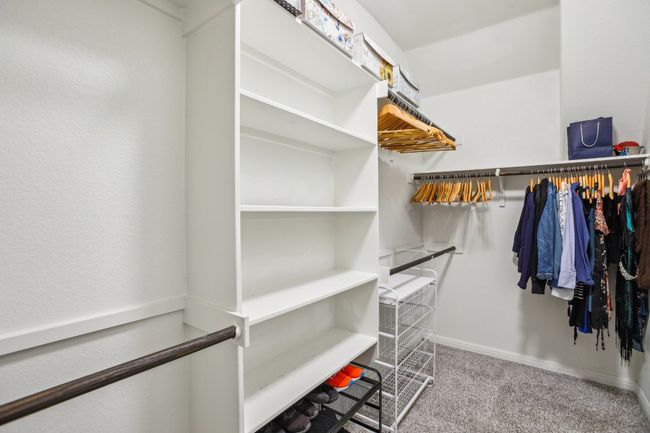Spacious closet with carpet floors | Image 19