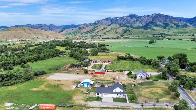Aerial view of sparsely populated area with a mountainous background | Image 83