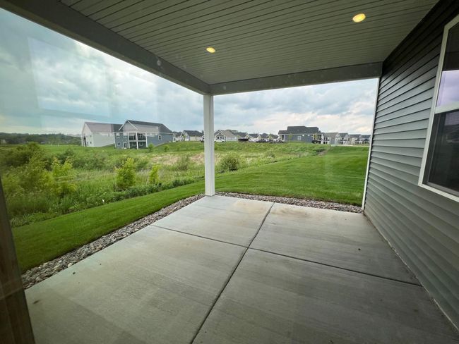 Photo is of the actual home. The back patio provides ample room for entertaining or relaxation! | Image 5