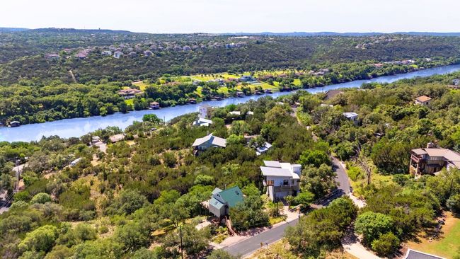 Aerial view of a nearby body of water and a forest | Image 36