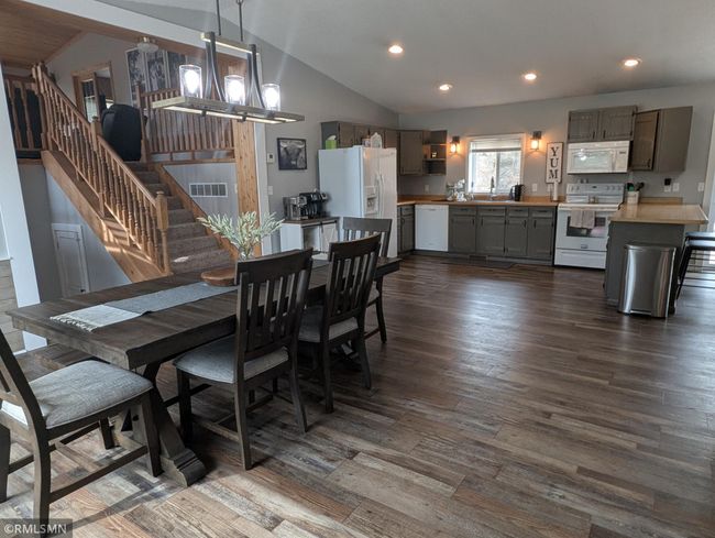 Stairs lead to lofted living room | Image 17
