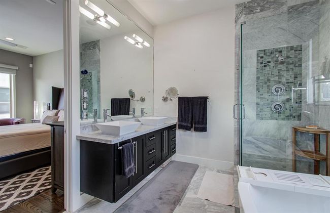 Another view of the primary bath with double sinks, walk in shower and separate soaking tub! | Image 28