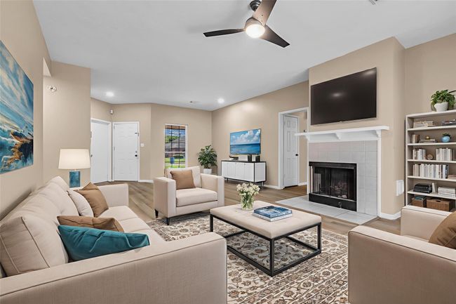 Visual staged! Incredible living room and den. Perfect for family gatherings and entertaining. | Image 6