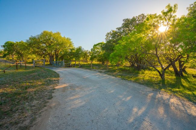 View of street featuring a rural view and a gate | Image 32
